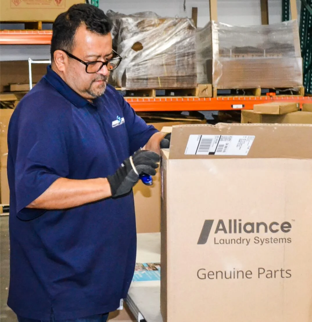 alliance team member shipping a box of genuine parts