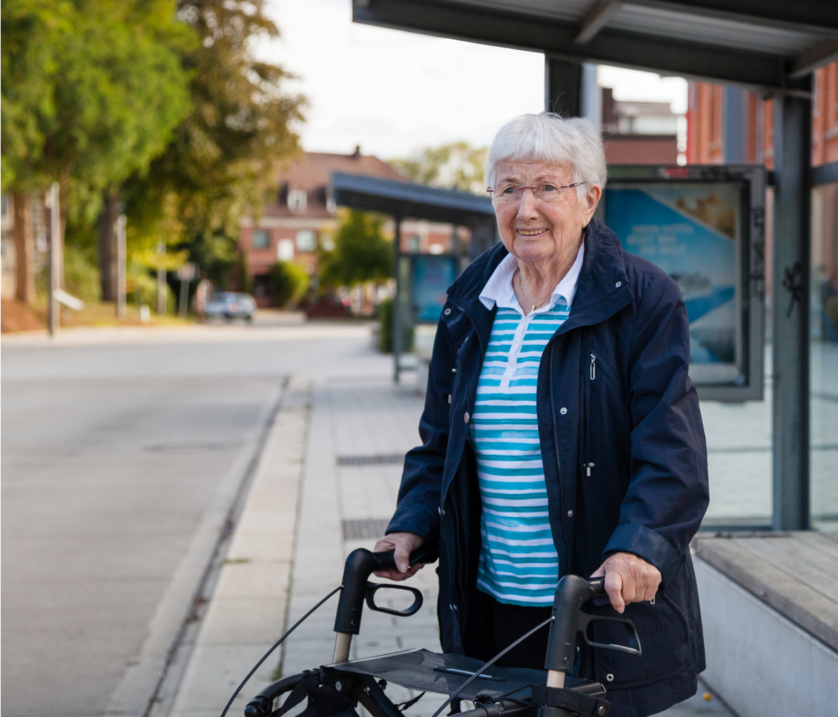 elderly woman at bus stop